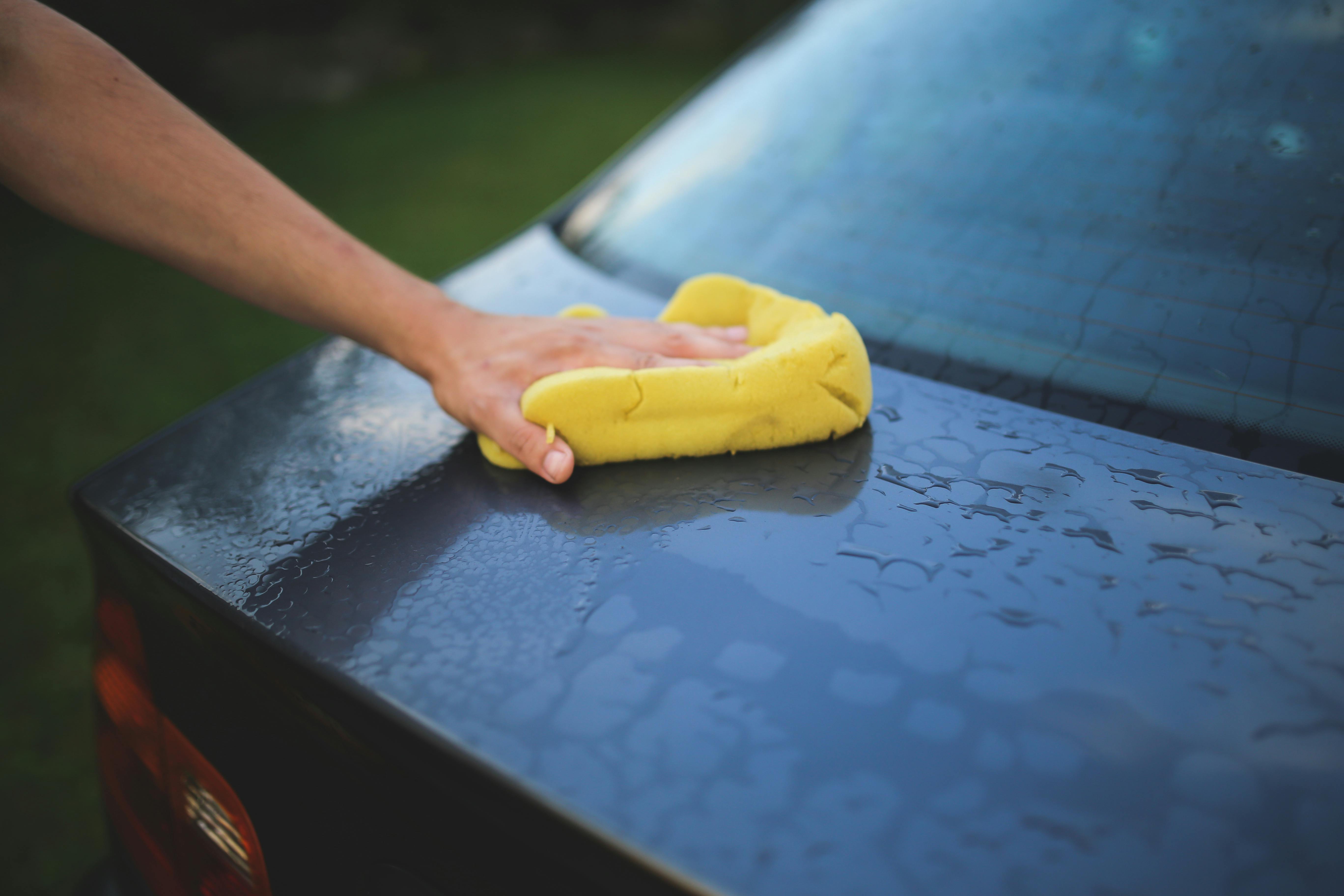 Car washing with yellow sponge