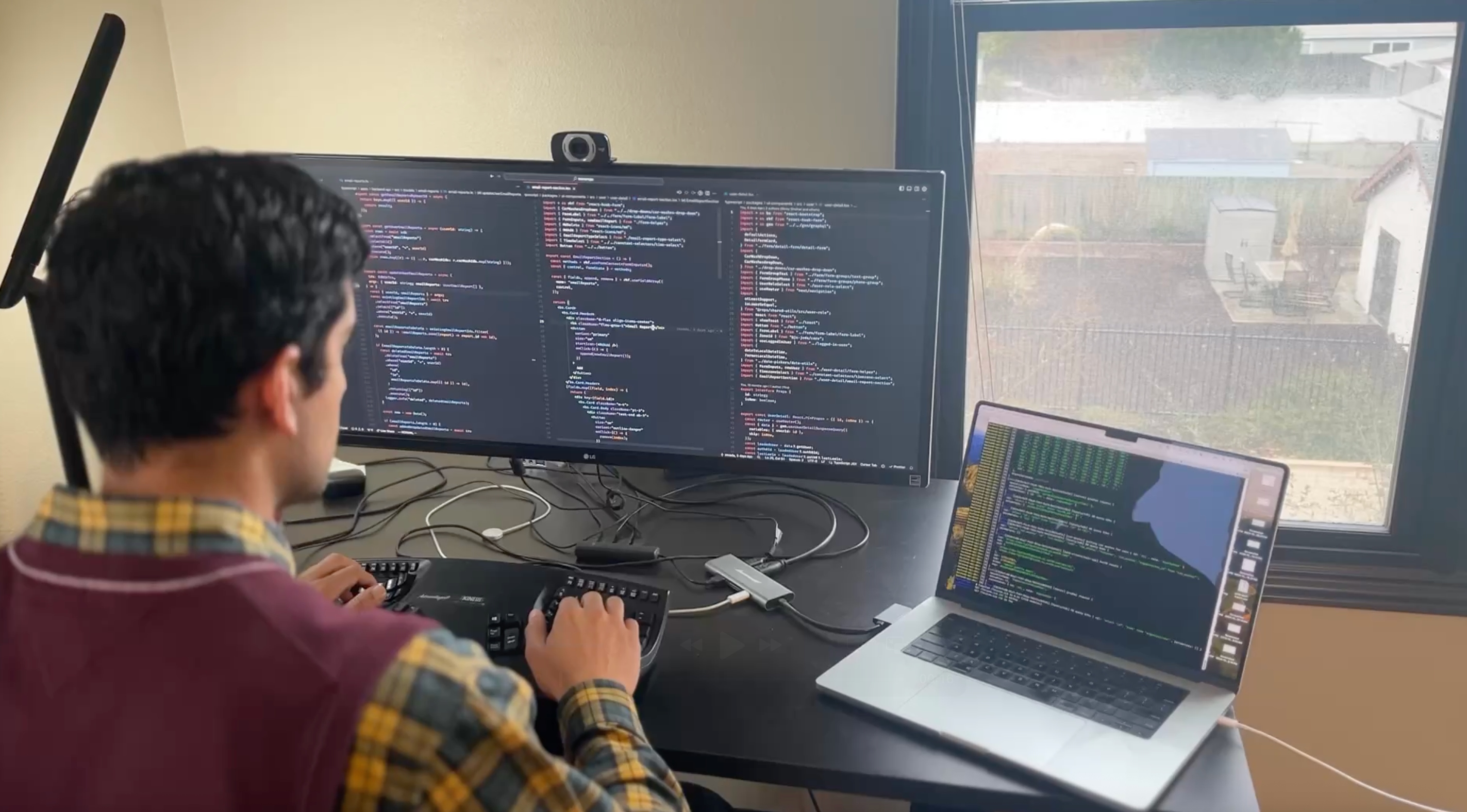 Software developer coding modern car wash POS system with advanced features and in-house development team